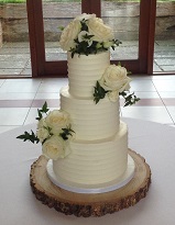 3 tier buttercream wedding with fresh flowers
